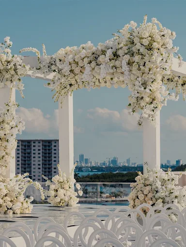 Floral chuppah at SIB JCC Waterfront with Miami skyline